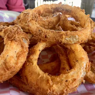 Hand battered onion ring. Fresh cut.