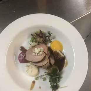 This is a plate from a multiple course catering event that the head chef and I made. The drip on the side was my fault.