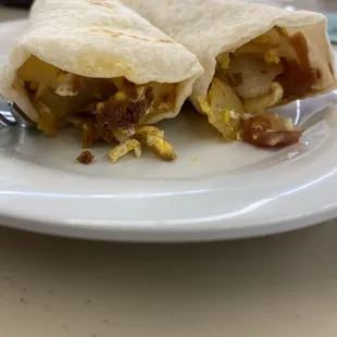 a breakfast burrito on a plate