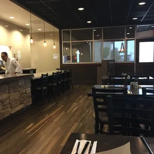 Front of restaurant includes counter with seating for five