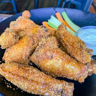 a plate of fried chicken wings