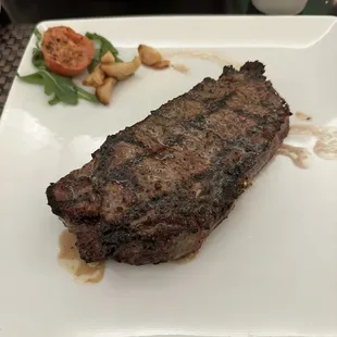 14oz NY strip steak. Cooked perfect, amazing seasoning and melts in your mouth.