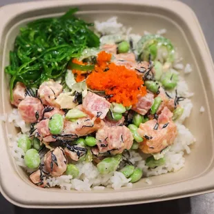 Poké bowl with seaweed, tobiko, Wakame, salmon, jalepeño and edamame.