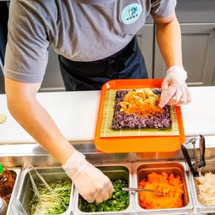 Preparing Sushi burritos