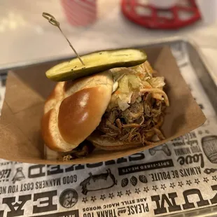 Messy pork sandwich piled high. Not the best, but not bad either.