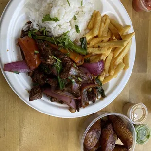Lomo salteado, rice , French fries and plantain