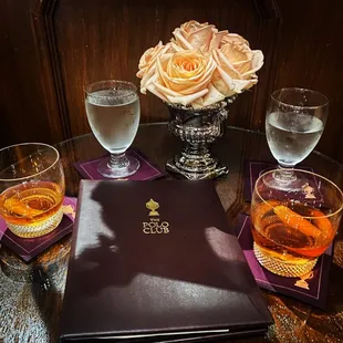 two glasses of wine and a menu