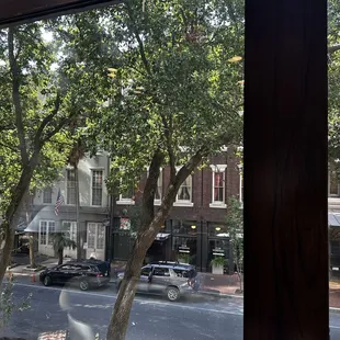 a view of a city street through a window