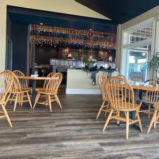 a dining room with wooden chairs