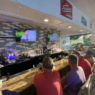 people sitting at the bar