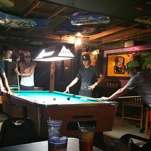 My guys playing pool in the back while waiting for lunch.