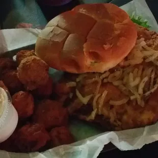 Beaded pork tenderloin sandwich with fried mushrooms.