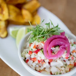 Coconut Ceviche with coconut serrano dressing and crispy plantains.