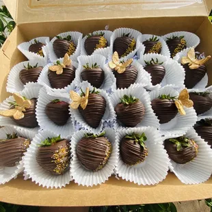 Dark chocolate covered strawberries with a hint of gold.