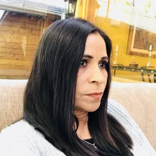 a woman sitting on a couch