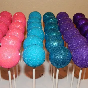 a variety of colored cake pops