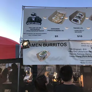 people standing under a tent