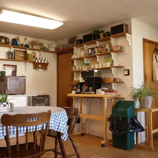 a kitchen with a table and chairs