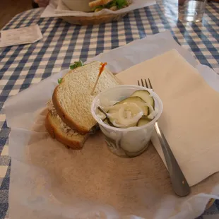 half chicken salad and pickled cucumbers