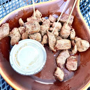 a plate of food with meat and sauce