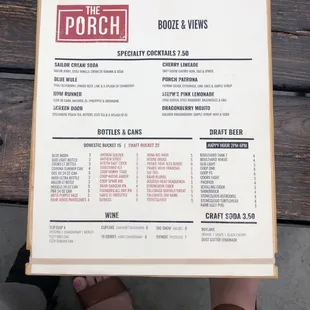 a person holding a menu