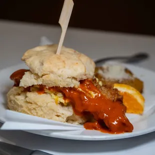 a plate of food with a biscuit on it