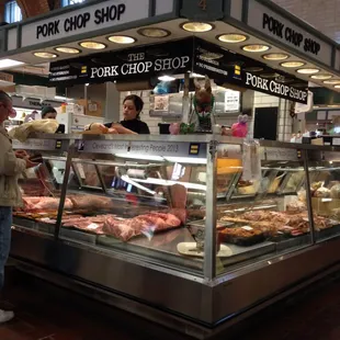a man standing in front of a display case