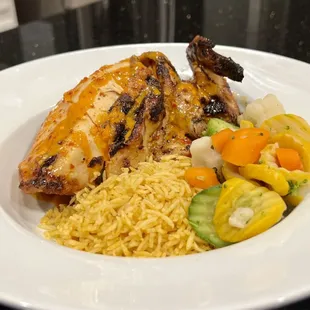 Medium spice Peri Peri chicken, signature rice, and steam veggies.