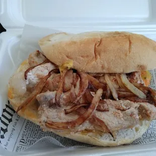 Bifana: Marinated pork cutlets with sauteed onions, coarse grain mustard and moida mayo