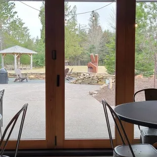 a view of a patio from inside a restaurant