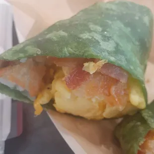 a burrito wrapped in lettuce