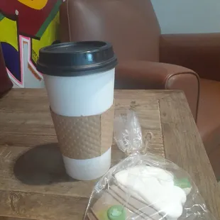 a cup of coffee and cookies