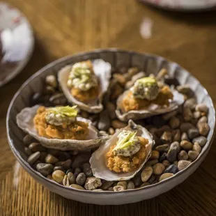 a plate of oysters and a glass of wine