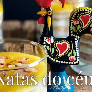 a rooster figurine on a table