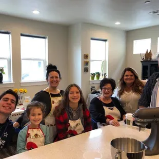 a group of people in a kitchen