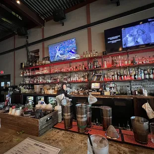 a bar with a variety of liquors