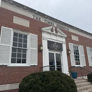 Entrance from downtown street near the Beatles Park and electric car charging spot (Surprising addition to this old towne!)!
