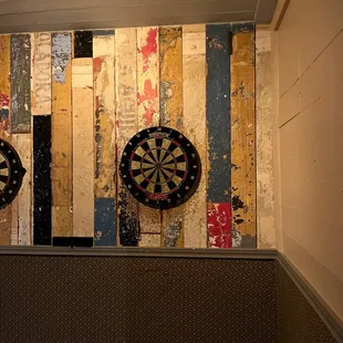 two darts on the wall