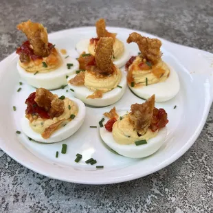 Deviled eggs with fried chicken skin on top