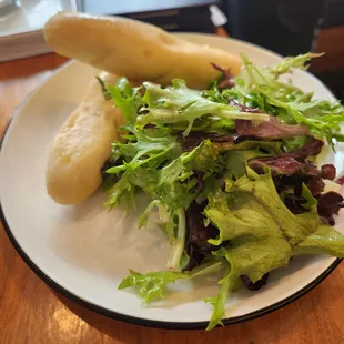 Side salad and breadsticks that came with pasta