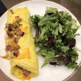 Denver omelette with side of greens.