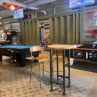 Interior- pool table, air hockey table, arcade games