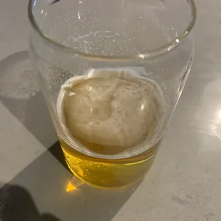 a glass of beer on a table