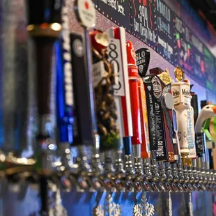 a row of beer taps