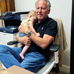 Founder, Dan Wesson, with Chelsea Dietz's, our Community Manager, precious baby Ellie