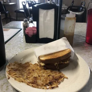 Becon egg cheese sandwich / hash browns.