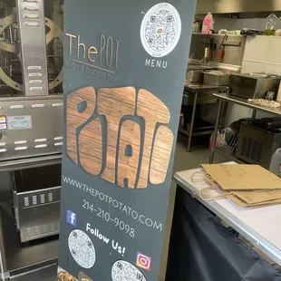 Pop up sign with QR codes for menu and social media pages