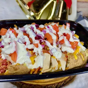 a hot dog covered in toppings