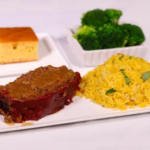 a plate of meat, rice and broccoli