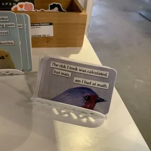 three cards with a bird on them